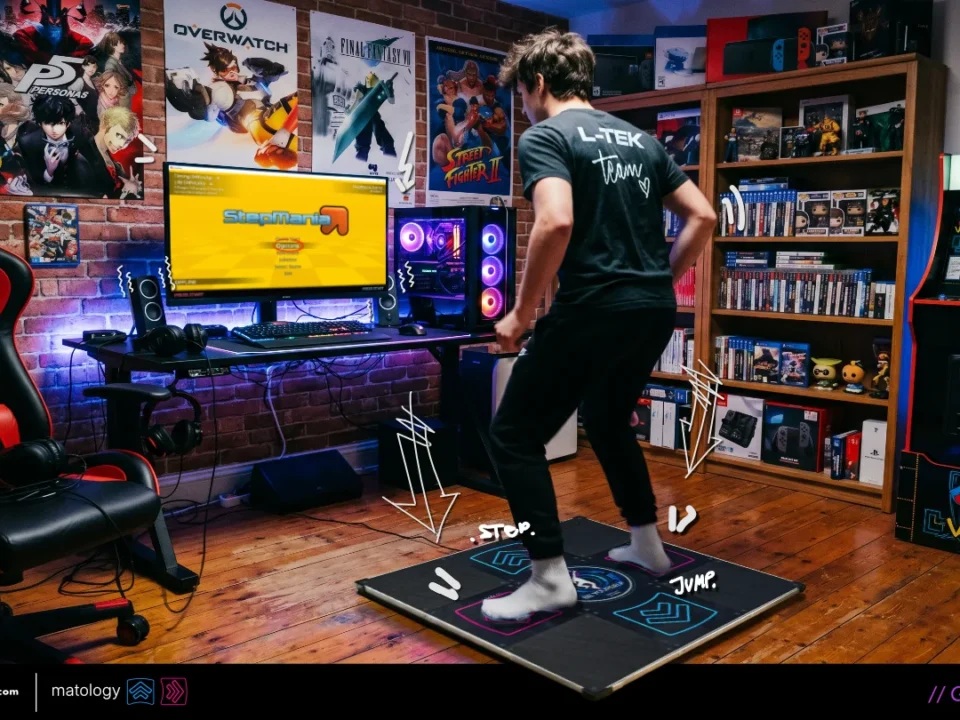A person on LTEK DDR dance pad with StepMania open on monitor in gaming room